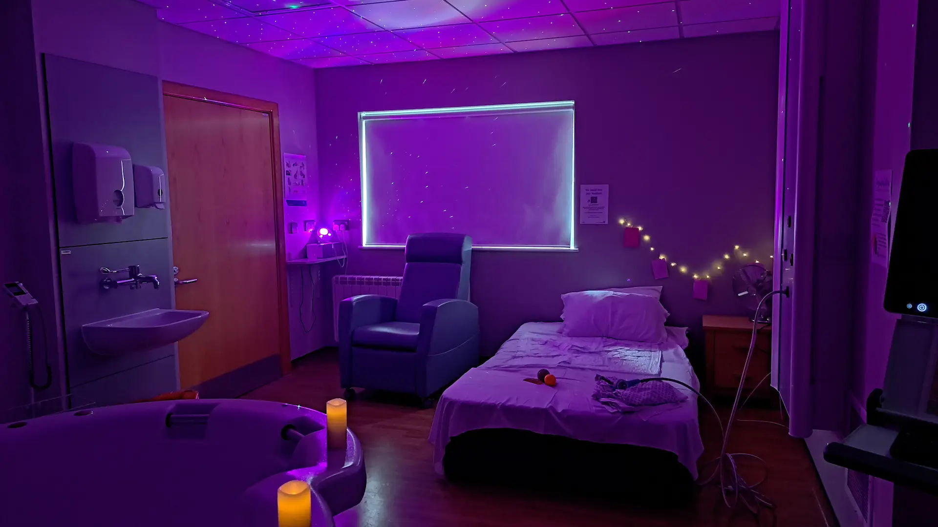 Low lighting, candles and fairy lights in hospital room