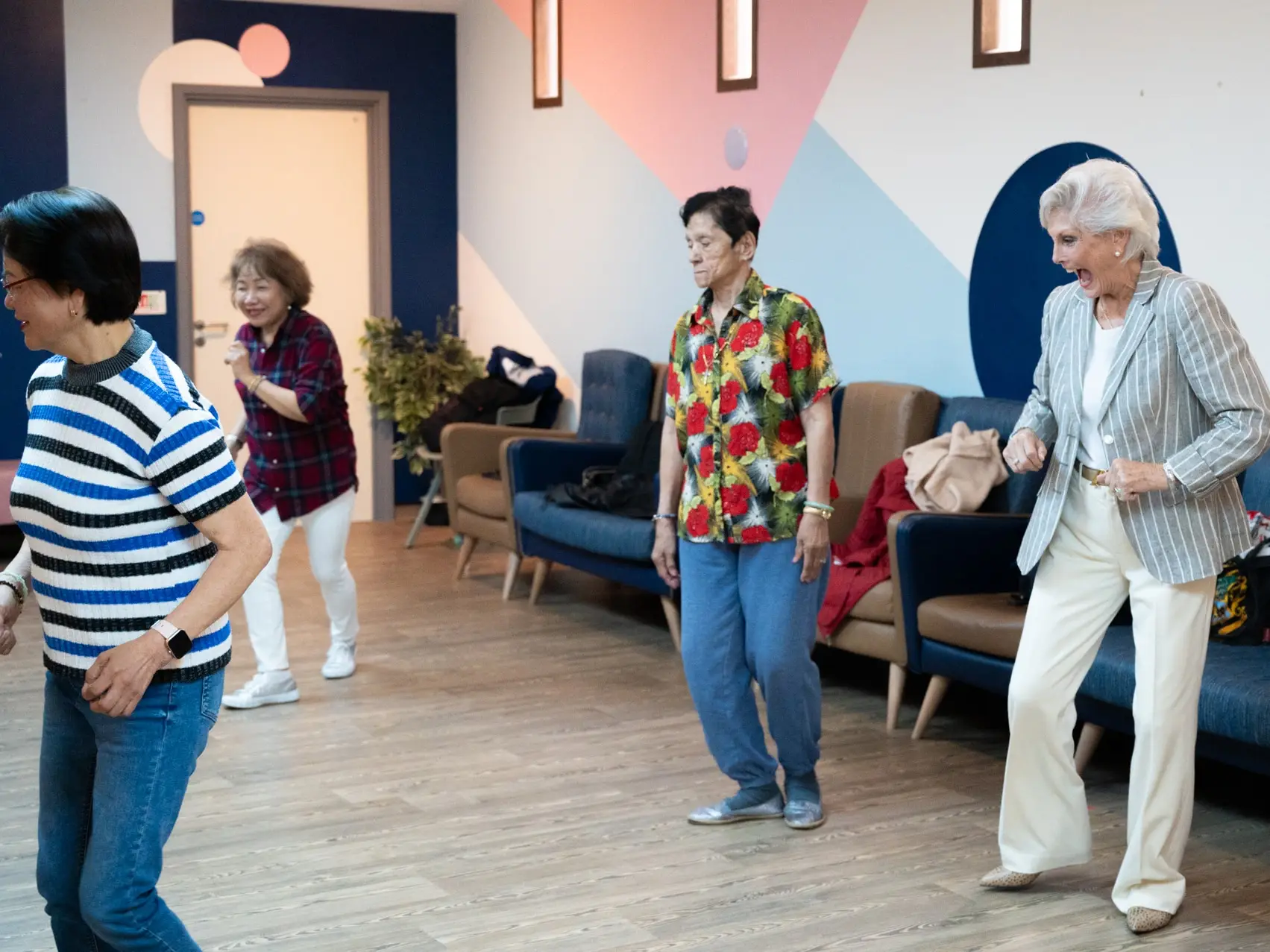 Angela Rippen dancing with patients in the CW+ Studio