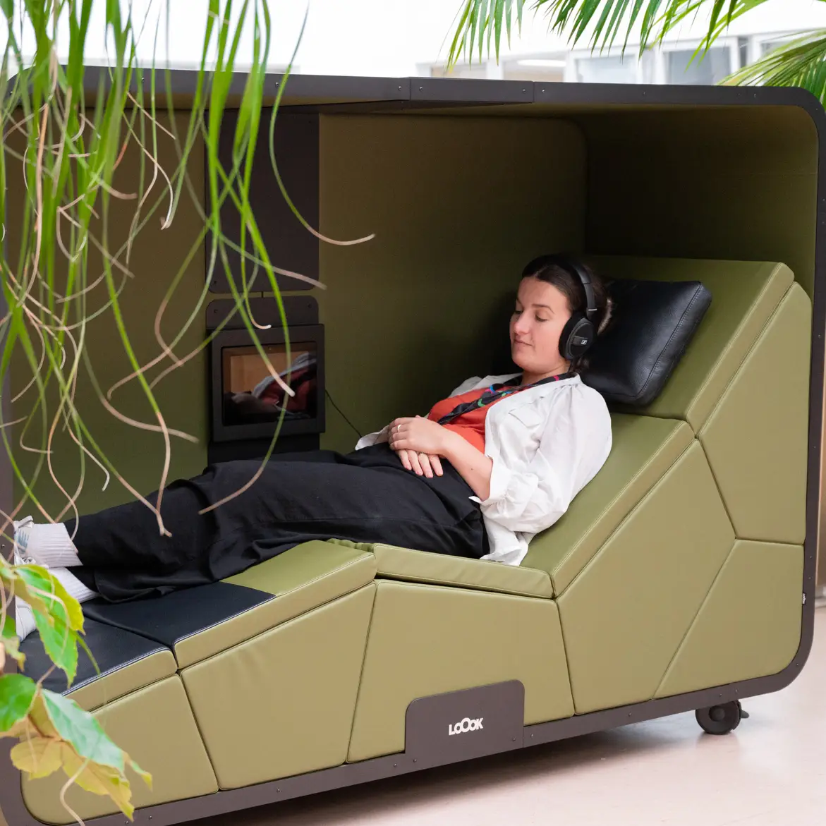 Woman relaxing in a sleep pod