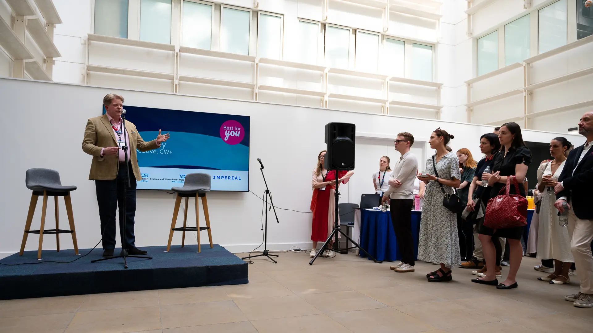 CEO of CW+ Chris Chaney delivering a speech about Best For You in front of an audience