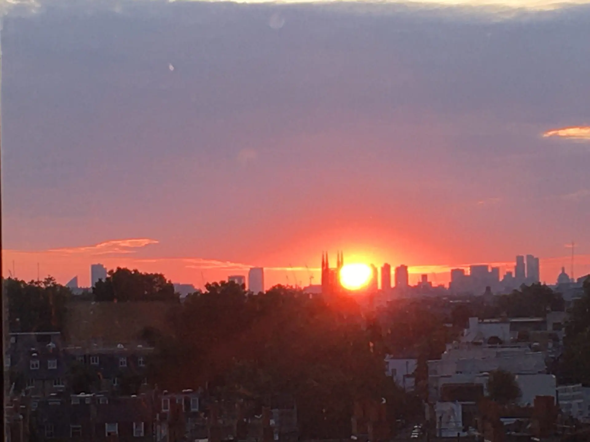 A photo of the sun rising over the City of London, taken from Chelsea and Westminster Hospital's St Mary Abbots ward