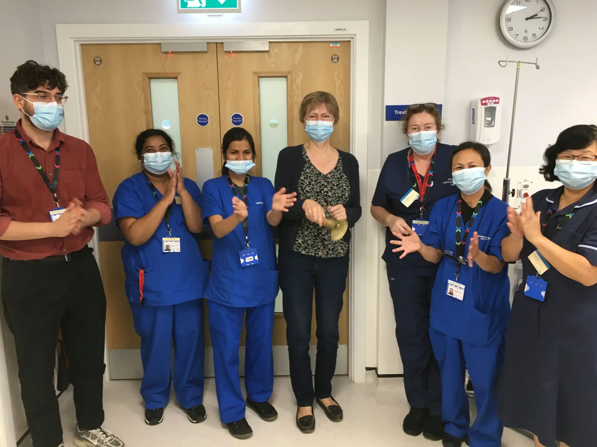 Case study Linda with staff after completing her cancer treatment